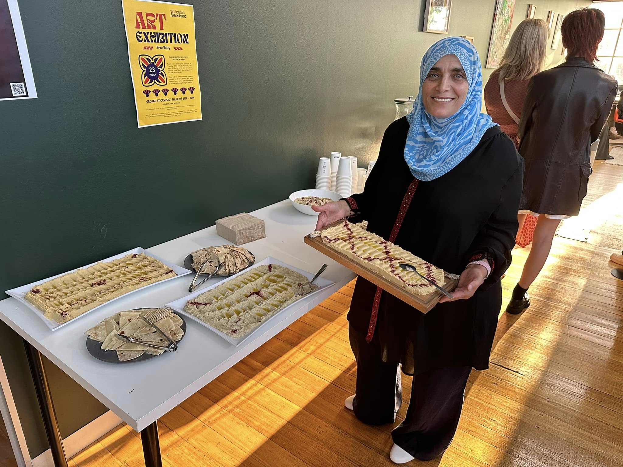 Chef Aheda serving handmade Palestinian dishes at a community event